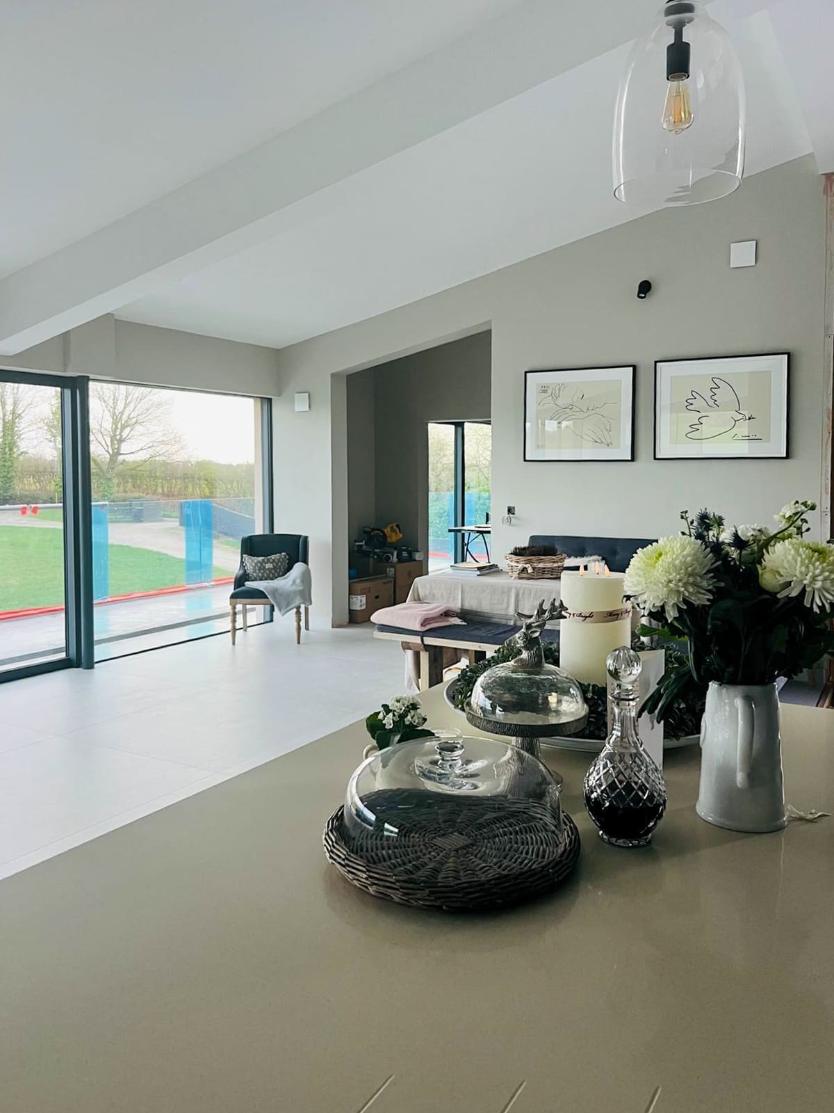 Open-plan living space with sliding glass doors opening onto the elevated terrace.