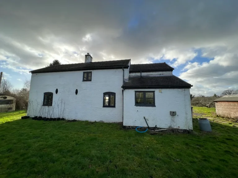 Existing rear elevation of The Sheiling before deep refurbishment and extension work